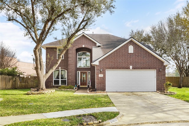 23602 Hawkins Creek Ct, Katy, TX 77494 - traditional-style home featuring brick siding, a garage, driveway, and roof with shingles