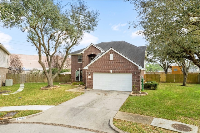 23602 Hawkins Creek Ct, Katy, TX 77494 - traditional-style home featuring brick siding, a garage, driveway, and a shingled roof