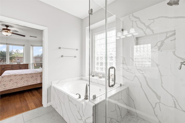 23602 Hawkins Creek Ct, Katy, TX 77494 - bathroom featuring a marble finish shower, a garden tub, ceiling fan, and ensuite bath