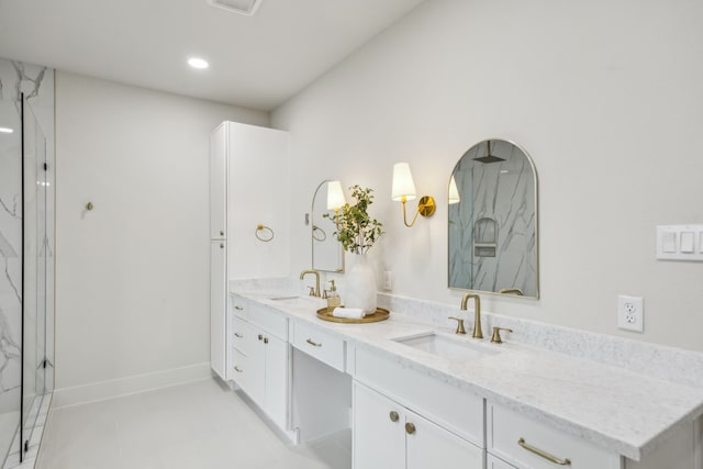 1265 Rd 66112, Dayton, TX 77535 - bathroom with double vanity, a marble finish shower, tile patterned flooring, and recessed lighting