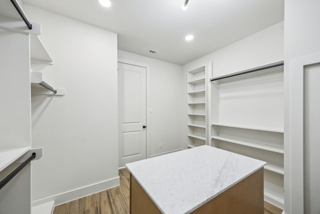 1265 Rd 66112, Dayton, TX 77535 - walk in closet featuring dark wood-style flooring