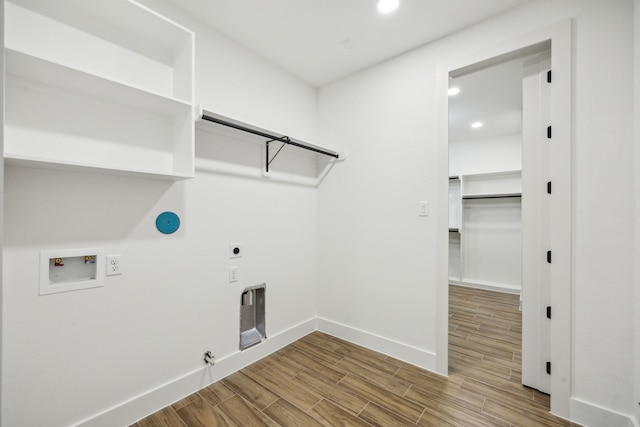 1265 Rd 66112, Dayton, TX 77535 - laundry area with gas dryer hookup, hookup for an electric dryer, washer hookup, wood finished floors, and recessed lighting