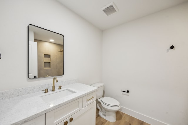 1265 Rd 66112, Dayton, TX 77535 - bathroom featuring wood finished floors, vanity, and a shower