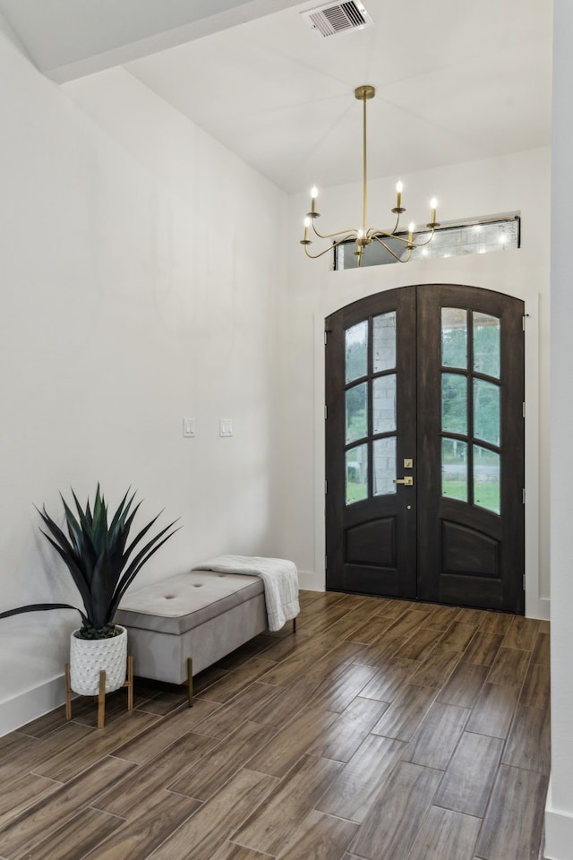 1265 Rd 66112, Dayton, TX 77535 - entryway featuring a chandelier, wood finished floors, and french doors