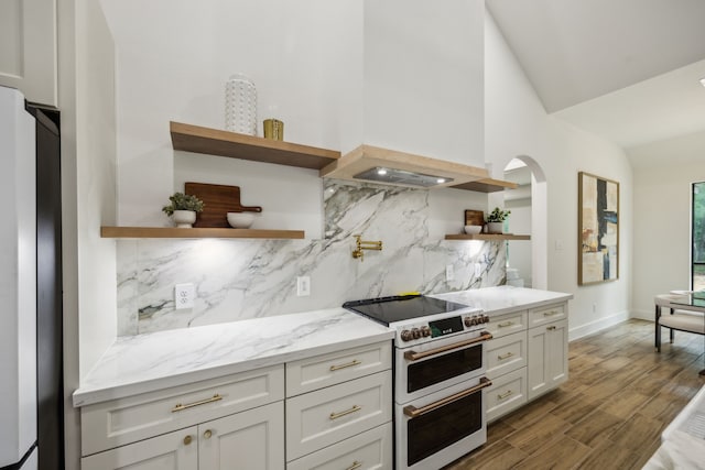 1265 Rd 66112, Dayton, TX 77535 - kitchen with white appliances, open shelves, decorative backsplash, light stone countertops, and vaulted ceiling