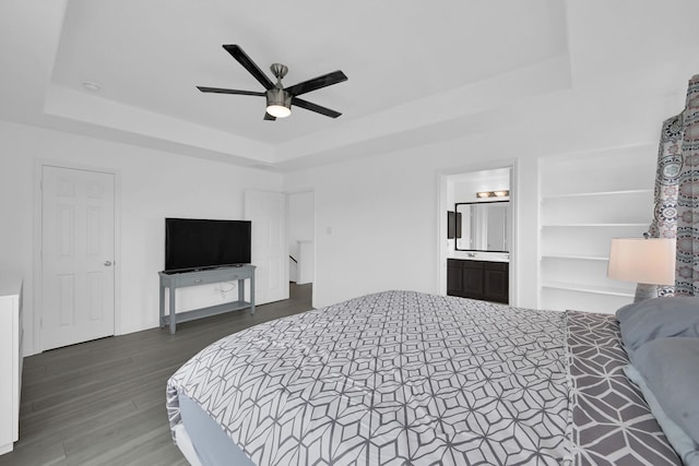 19210 Kent Park Dr, Tomball, TX 77375 - bedroom with a raised ceiling, wood finished floors, ceiling fan, and ensuite bathroom