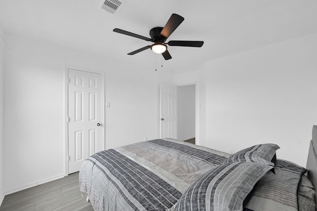 19210 Kent Park Dr, Tomball, TX 77375 - bedroom featuring wood finished floors and ceiling fan
