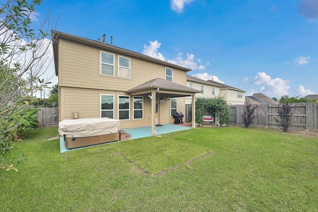 19210 Kent Park Dr, Tomball, TX 77375 - rear view of property featuring a hot tub, a patio area, and a fenced backyard