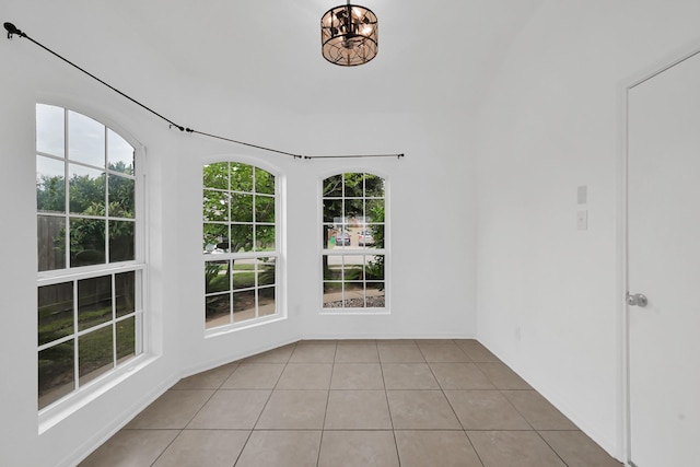 19210 Kent Park Dr, Tomball, TX 77375 - unfurnished room with light tile patterned floors and a chandelier