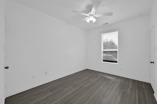 19210 Kent Park Dr, Tomball, TX 77375 - spare room featuring dark wood-style flooring and a ceiling fan