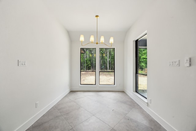 1253 Rd 66112, Dayton, TX 77535 - tiled empty room featuring a chandelier and baseboards