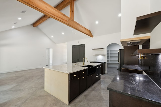 1253 Rd 66112, Dayton, TX 77535 - kitchen with open shelves, arched walkways, beam ceiling, high vaulted ceiling, and finished concrete floors