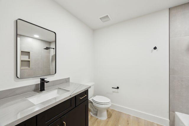 1253 Rd 66112, Dayton, TX 77535 - bathroom featuring vanity, wood finished floors, a shower, and a bath