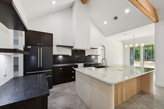 1253 Rd 66112, Dayton, TX 77535 - kitchen featuring high quality fridge, high vaulted ceiling, beamed ceiling, tasteful backsplash, and stone counters