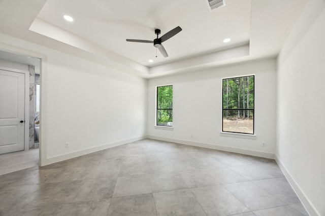1253 Rd 66112, Dayton, TX 77535 - unfurnished room with a tray ceiling, a ceiling fan, and recessed lighting