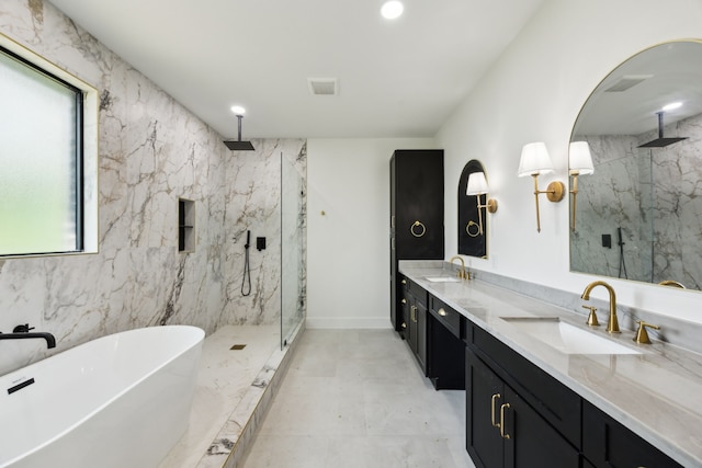 1253 Rd 66112, Dayton, TX 77535 - bathroom with a marble finish shower, double vanity, a freestanding tub, and recessed lighting