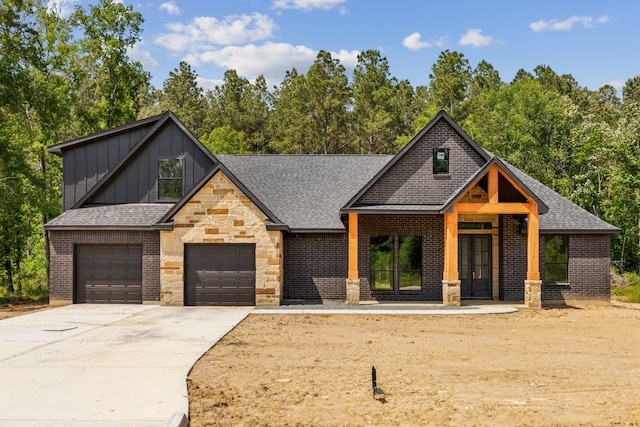 1253 Rd 66112, Dayton, TX 77535 - modern farmhouse style home featuring board and batten siding, driveway, a shingled roof, and brick siding
