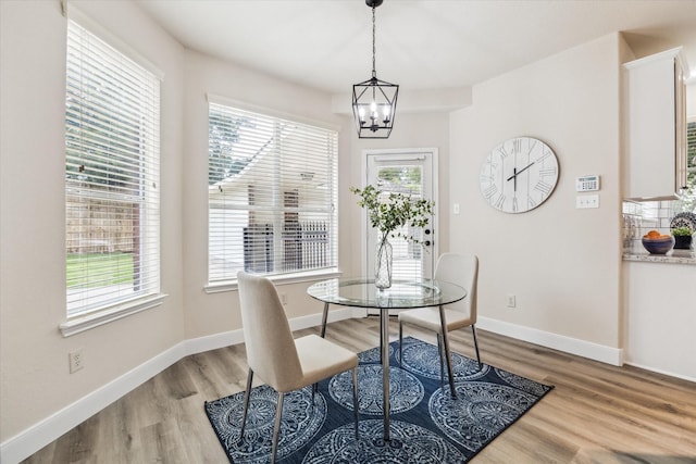 13411 Via Chianti Ln, Cypress, TX 77429 - dining area with light wood-type flooring and a chandelier