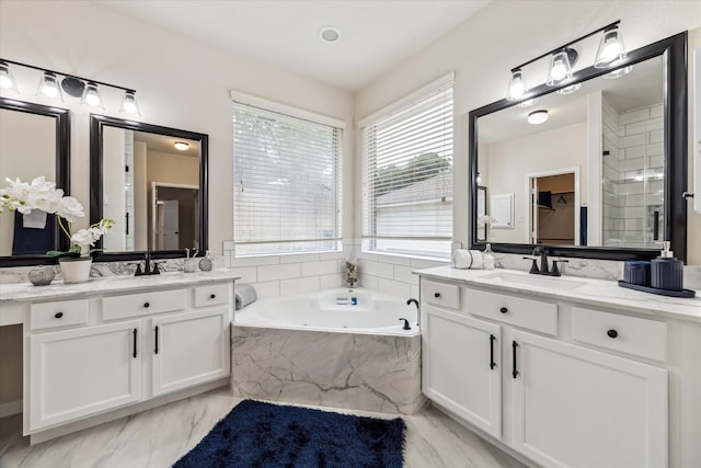13411 Via Chianti Ln, Cypress, TX 77429 - full bathroom with two vanities, a garden tub, marble finish floors, and a closet
