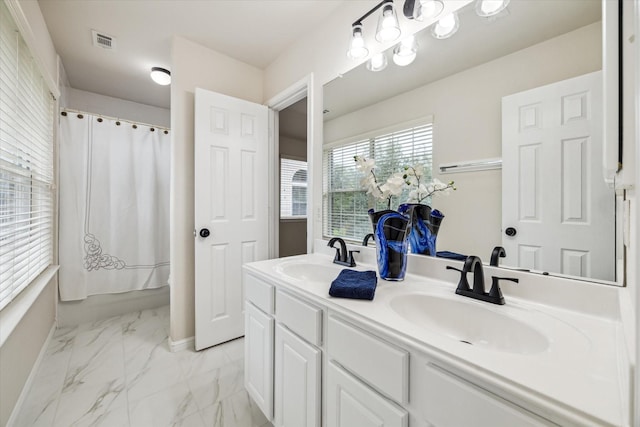 13411 Via Chianti Ln, Cypress, TX 77429 - bathroom featuring double vanity and marble finish floors