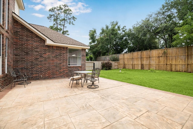 13411 Via Chianti Ln, Cypress, TX 77429 - fenced backyard with a patio and outdoor dining area