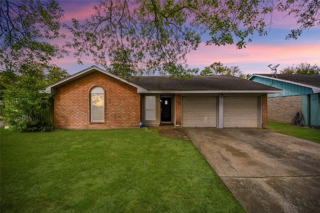 14803 Sunwick St, Houston, TX 77060 - ranch-style house featuring an attached garage, concrete driveway, a yard, and brick siding