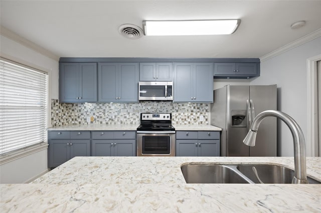 3835 Tartan Ln, Houston, TX 77025 - kitchen featuring stainless steel appliances, ornamental molding, decorative backsplash, and light stone counters