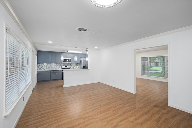3835 Tartan Ln, Houston, TX 77025 - unfurnished living room with crown molding, wood finished floors, and recessed lighting