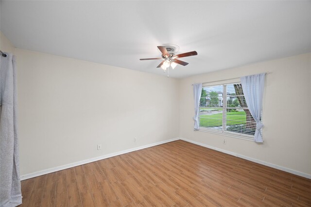 3835 Tartan Ln, Houston, TX 77025 - empty room with ceiling fan and wood finished floors