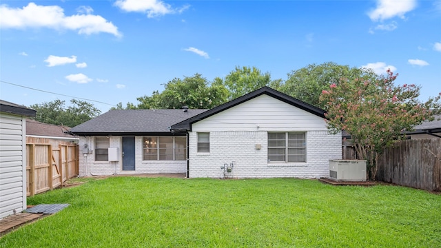 3835 Tartan Ln, Houston, TX 77025 - back of house featuring brick siding, a fenced backyard, and roof with shingles