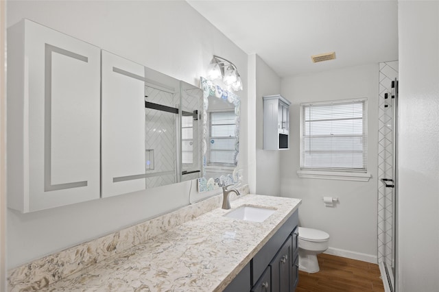 3835 Tartan Ln, Houston, TX 77025 - full bathroom with vanity, wood finished floors, and a shower with shower door