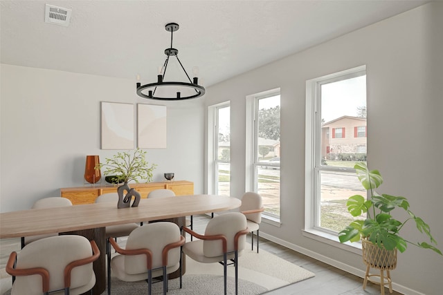 2330 Grindstone Ln, Sugar Land, TX 77498 - dining room with a chandelier and light wood-style flooring