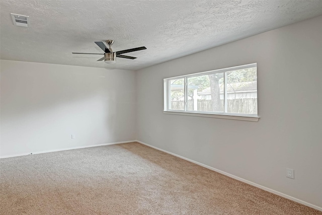 2330 Grindstone Ln, Sugar Land, TX 77498 - unfurnished room featuring ceiling fan, carpet flooring, and a textured ceiling