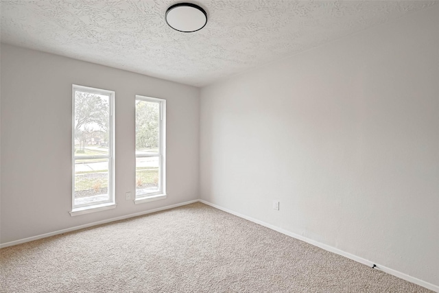 2330 Grindstone Ln, Sugar Land, TX 77498 - carpeted empty room featuring a textured ceiling and baseboards