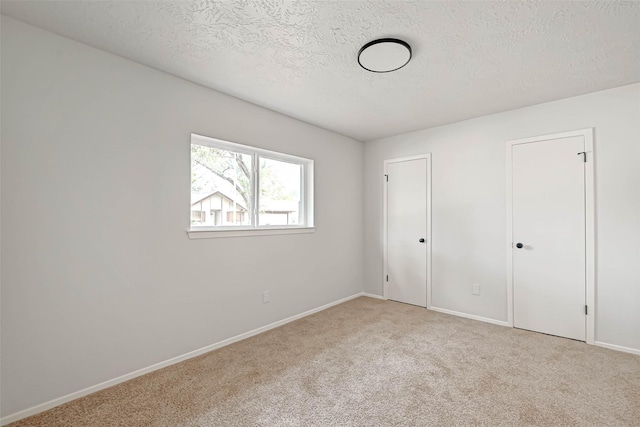 2330 Grindstone Ln, Sugar Land, TX 77498 - unfurnished bedroom with a textured ceiling and carpet