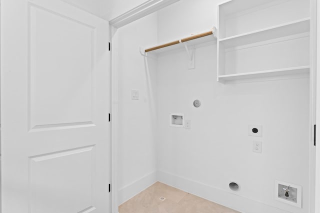1428 Miller St, Houston, TX 77003 - washroom featuring hookup for an electric dryer, hookup for a washing machine, gas dryer hookup, and light tile patterned flooring