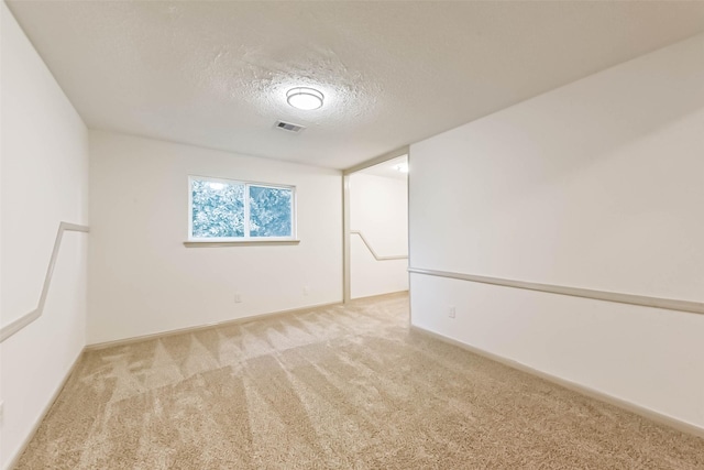 4214 Brightwood Dr, Houston, TX 77068 - carpeted spare room featuring a textured ceiling and baseboards