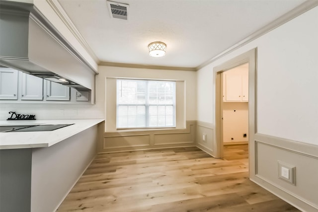 4214 Brightwood Dr, Houston, TX 77068 - unfurnished dining area with ornamental molding, light wood finished floors, and wainscoting