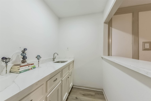 4214 Brightwood Dr, Houston, TX 77068 - bar featuring a sink and light wood-type flooring