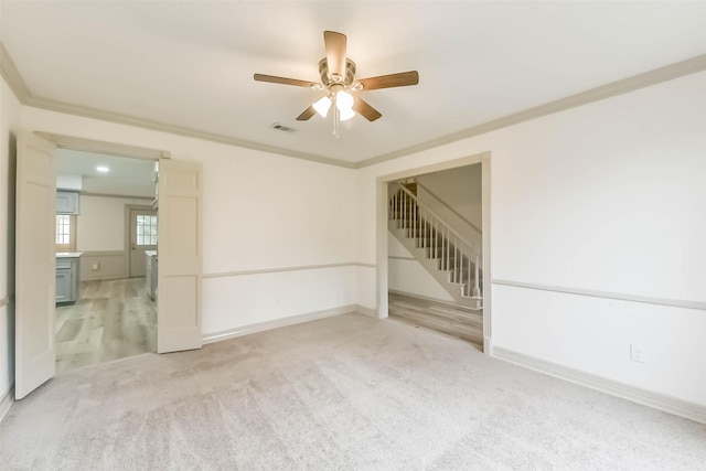 4214 Brightwood Dr, Houston, TX 77068 - unfurnished room featuring a ceiling fan, light carpet, stairway, and ornamental molding