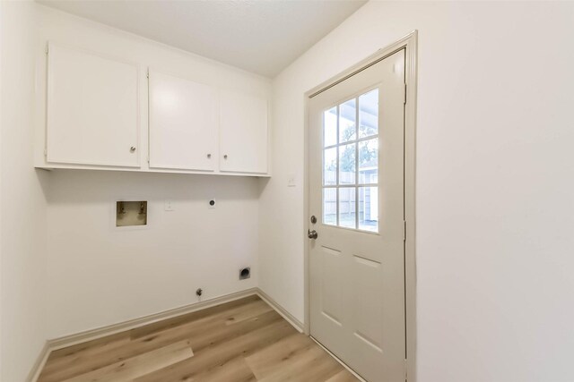 4214 Brightwood Dr, Houston, TX 77068 - washroom with hookup for an electric dryer, light wood-type flooring, hookup for a washing machine, hookup for a gas dryer, and cabinet space