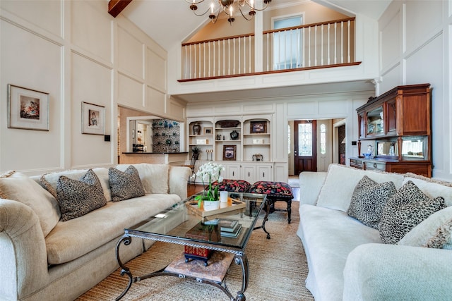 510 Commodore Way, Houston, TX 77079 - living area featuring a decorative wall, high vaulted ceiling, and a chandelier