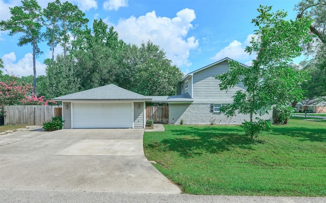 725 River Plantation Dr, Conroe, TX 77302 - view of front facade with a garage and brick siding