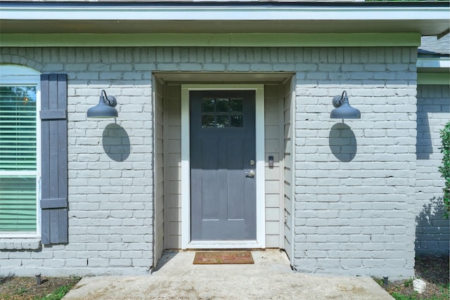 725 River Plantation Dr, Conroe, TX 77302 - doorway to property featuring brick siding
