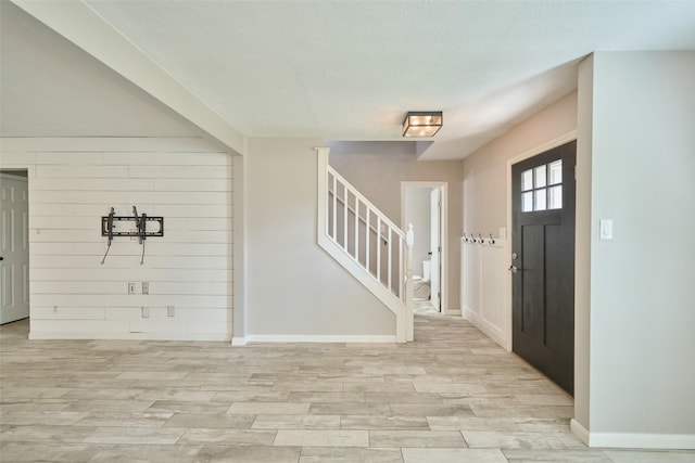 725 River Plantation Dr, Conroe, TX 77302 - foyer entrance with light wood-style flooring and stairs