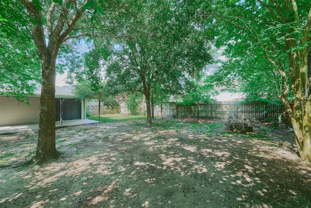725 River Plantation Dr, Conroe, TX 77302 - fenced backyard featuring a patio area