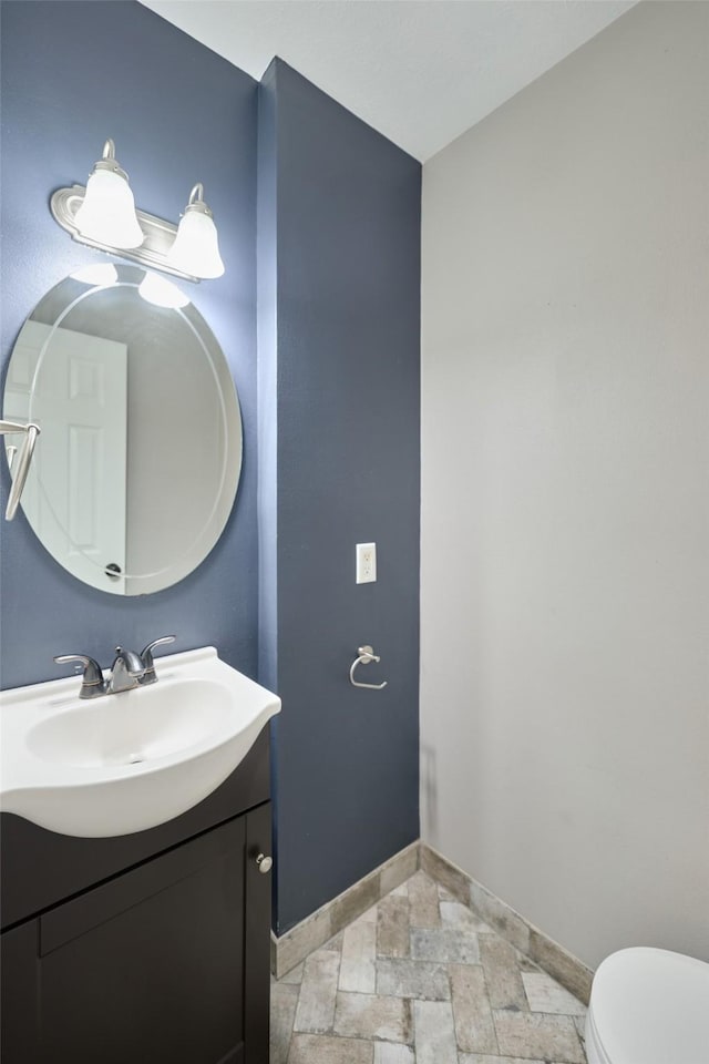 725 River Plantation Dr, Conroe, TX 77302 - half bath featuring vanity and stone tile floors