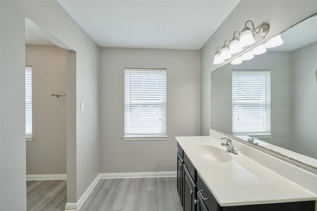 725 River Plantation Dr, Conroe, TX 77302 - bathroom with wood finished floors and vanity