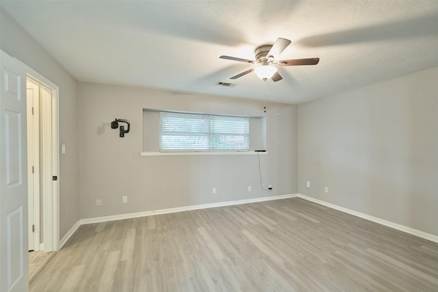 725 River Plantation Dr, Conroe, TX 77302 - unfurnished room featuring light wood finished floors and ceiling fan