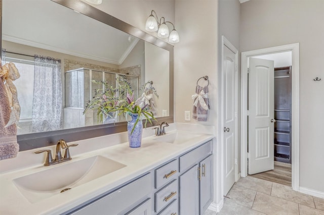 3515 Cactus Field Ln, Katy, TX 77449 - full bath with double vanity, crown molding, a shower stall, tile patterned flooring, and vaulted ceiling